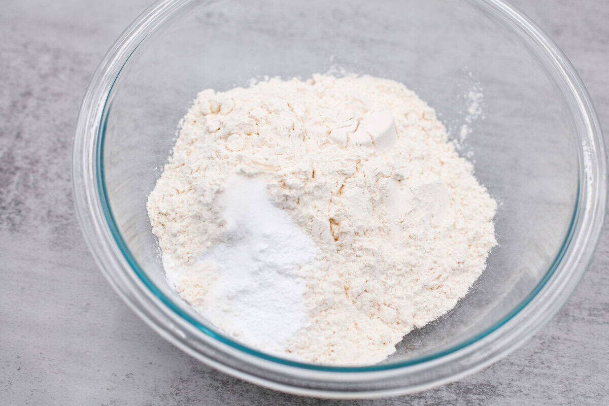 If you’ve never tried a congo bar, they’re basically chocolate chip cookie bars with a little added flair. They’re usually made with chopped nuts or coconut for some extra texture, and let me tell you… They are what dreams are made of. Bowl of dry ingredients.