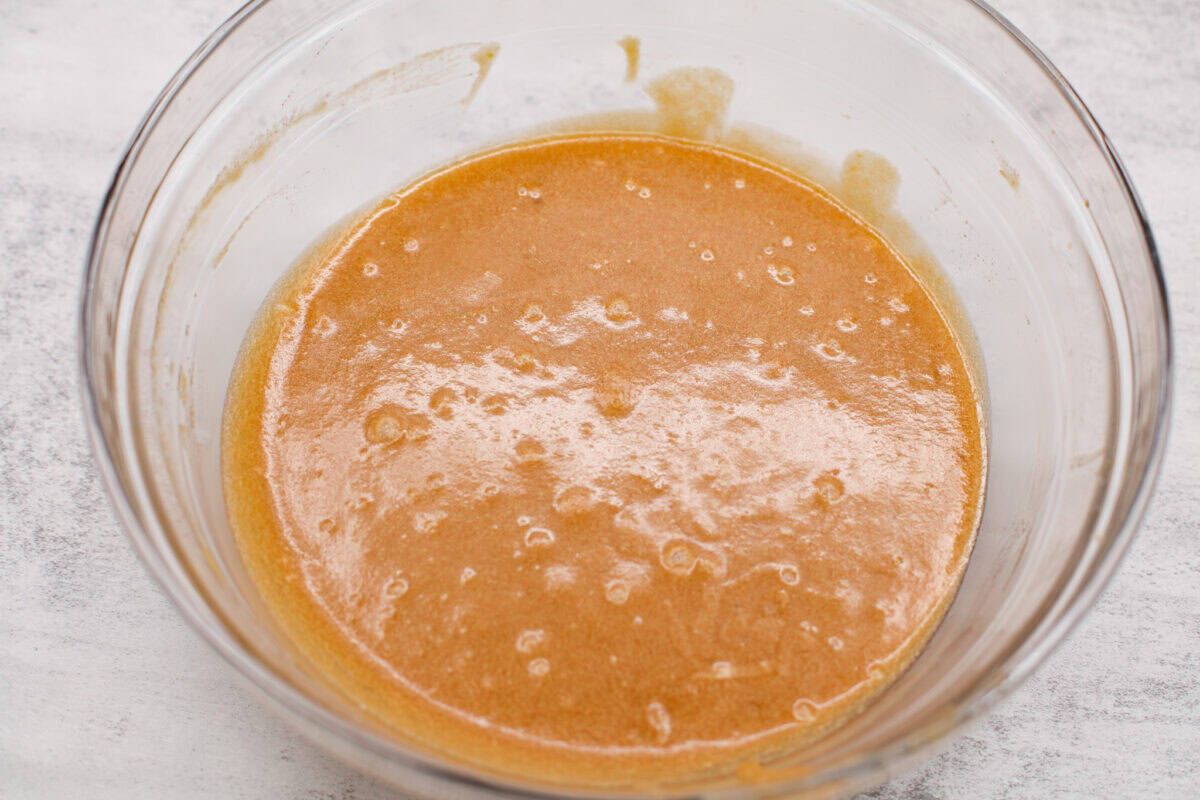 If you’ve never tried a congo bar, they’re basically chocolate chip cookie bars with a little added flair. They’re usually made with chopped nuts or coconut for some extra texture, and let me tell you… They are what dreams are made of. Bowl of wet ingredients mixed together.