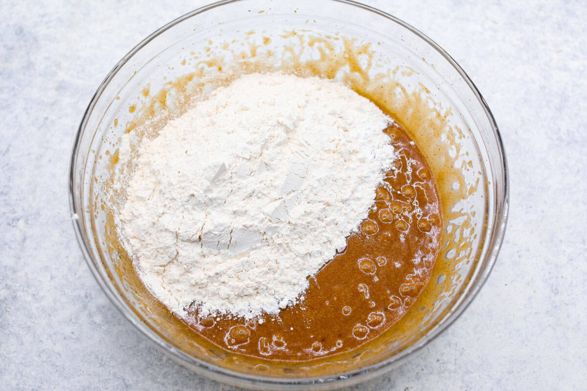 If you’ve never tried a congo bar, they’re basically chocolate chip cookie bars with a little added flair. They’re usually made with chopped nuts or coconut for some extra texture, and let me tell you… They are what dreams are made of. Dry ingredients added to the wet ingredients.