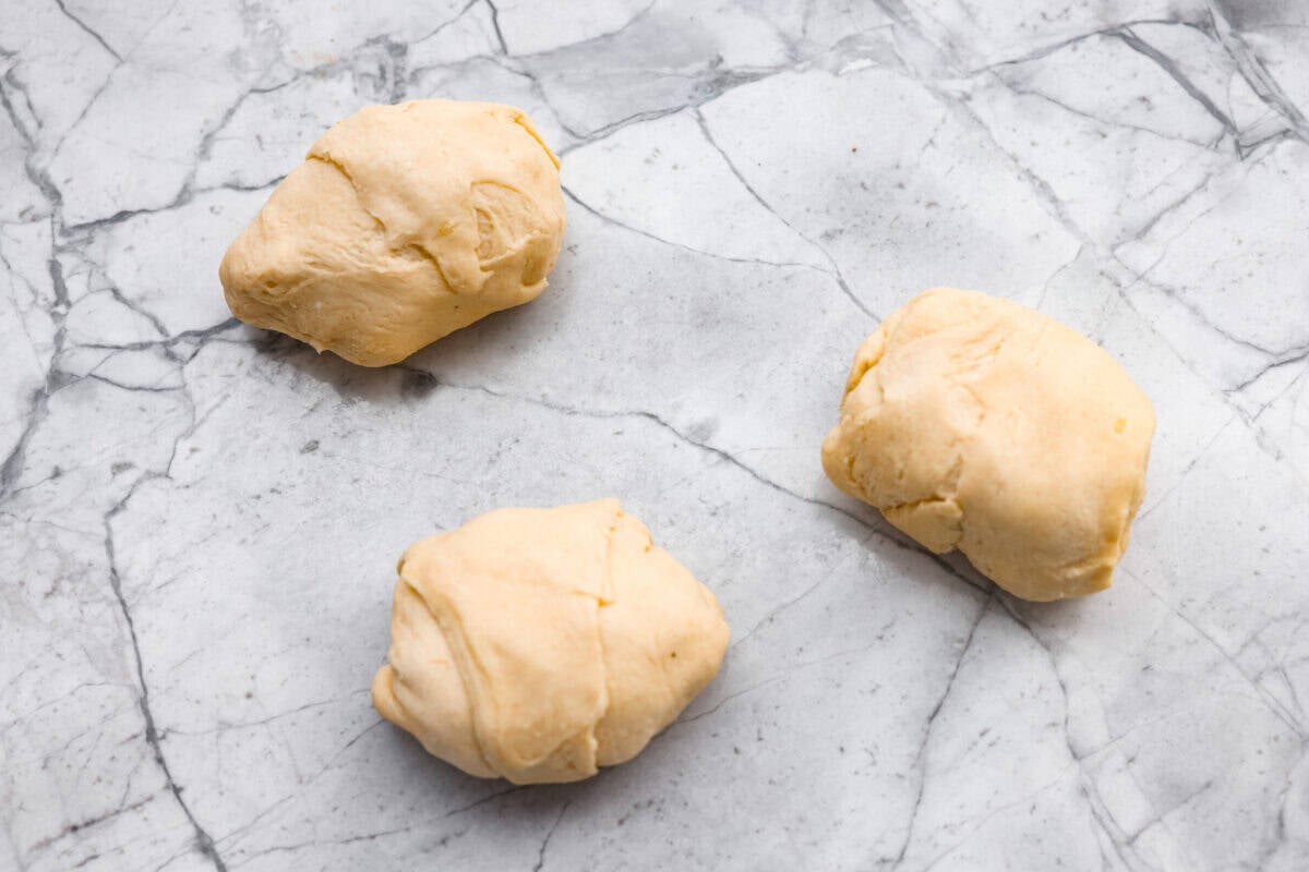 Crescent dough rolled up around the chicken mixture.