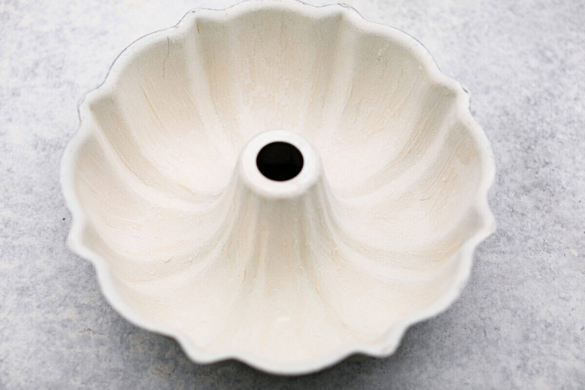 This sour cream pound cake is buttery, moist, and so tender. The light vanilla flavor with a little tang from the sour cream makes it delicious on its own, or even better with berries, whipped cream, or ice cream. Greased and floured bundt pan.