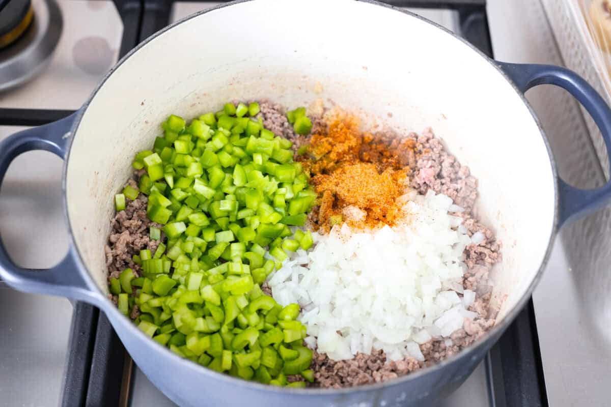 Why is it called “dirty” rice? The rice gets brown as it cooks with meat, Cajun spices, and the holy trinity of Cajun cooking: onion, bell pepper, and celery. My version combines ground pork and beef for a flavorful twist on this Louisiana classic! Veggies and spices added to the ground beef and pork.