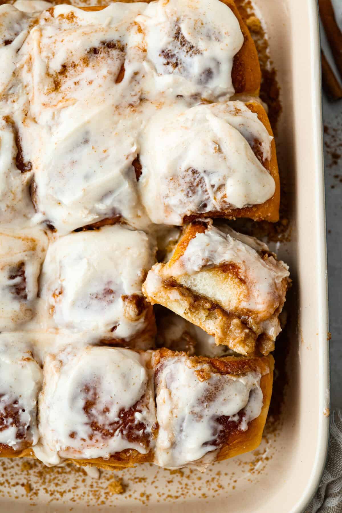 Sometimes you just need warm, gooey cinnamon rolls without the hours of waiting. These Hawaiian Roll Cinnamon Rolls are the cozy little hack that bring all the cinnamon-sugar joy with half the effort. Overhead shot of baked and frosted Hawaiian roll cinnamon rolls.