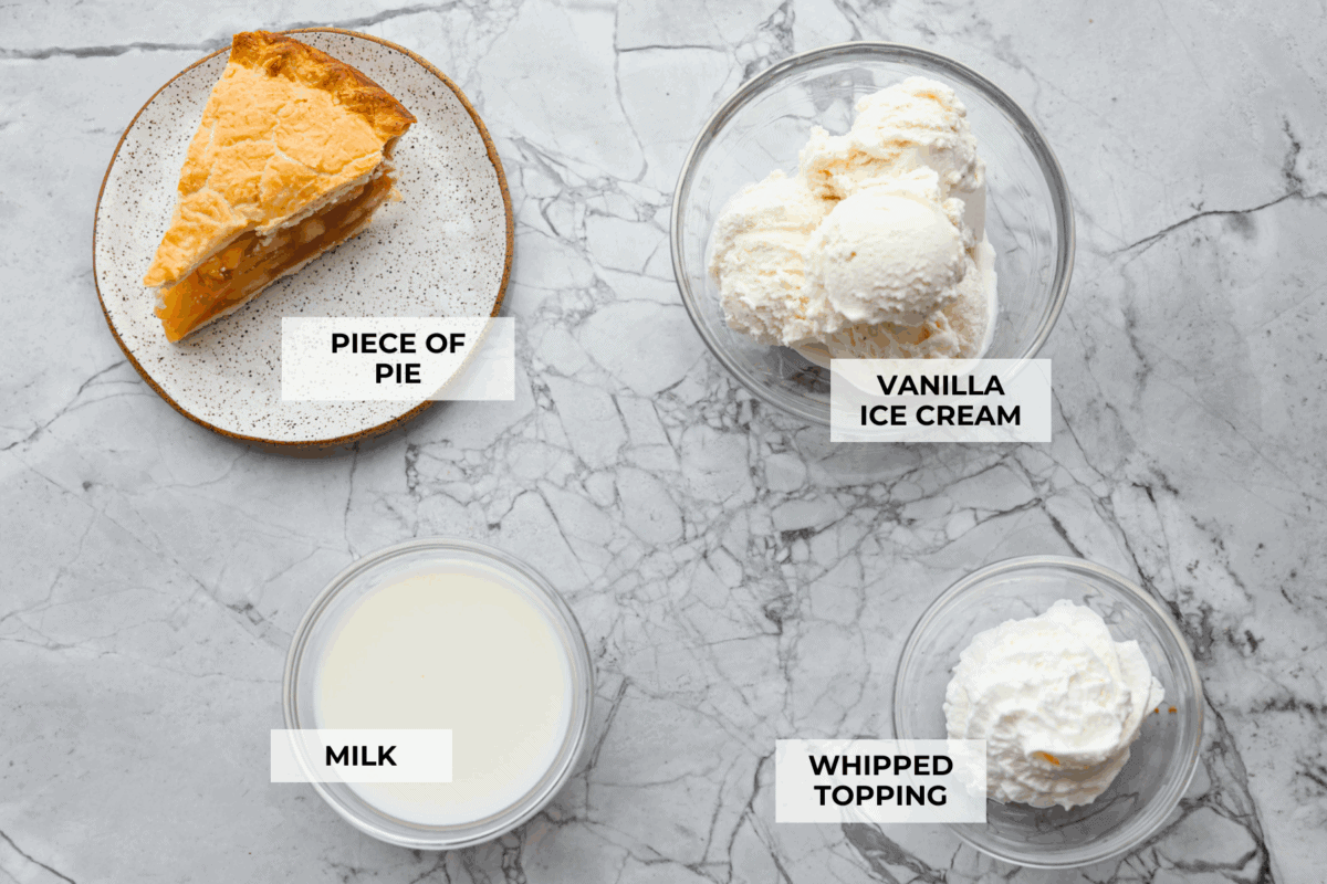 Leftover pie milkshakes are the sweetest way to give your extra pie new life! Just grab a slice, blend it with creamy ice cream, and sip your way to dessert bliss. Overhead shot of labeled ingredients.