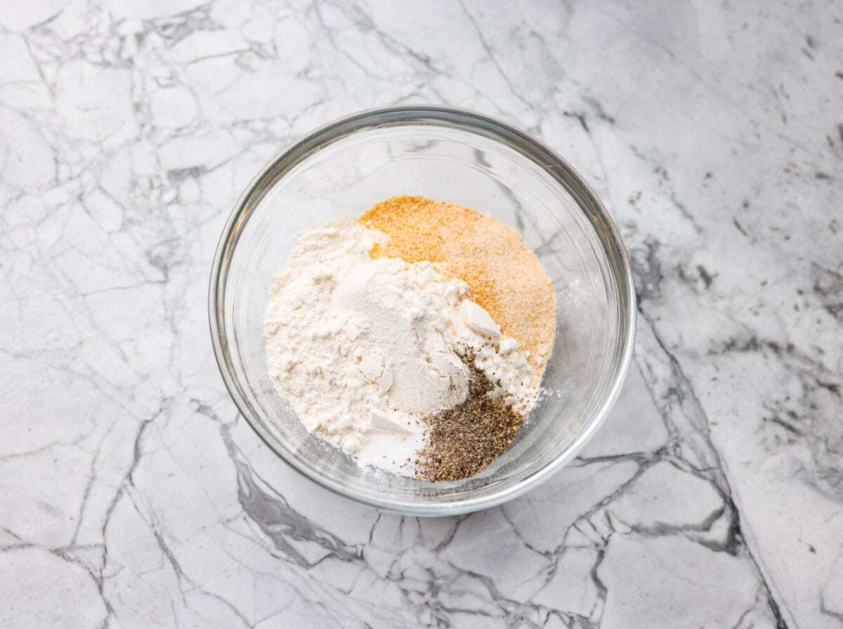 Forget the usual biscuits and gravy, this version takes everything you love and turns it into one irresistible, bubbly casserole. Creamy sausage gravy, buttery biscuits, and zero stress. Seasonings and flour in a small bowl.