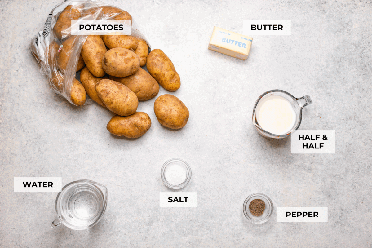 You MUST TRY these crockpot mashed potatoes! They are so creamy and delicious and super easy to make! Which makes them the perfect side for any meal. Overhead shot of labeled ingredients.