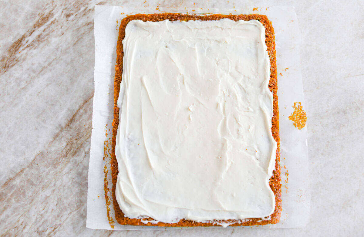 This really is the world’s best pumpkin roll! Soft, moist pumpkin cake wrapped around a sweet cream cheese filling and finished with a dusting of powdered sugar, it’s pure fall magic. The best part? It’s surprisingly easy to make. Cream cheese spread on the cooked and cooled cake.