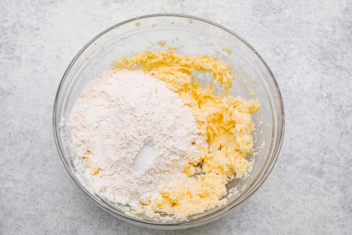 Meet the upgraded Twix thumbprint cookies! I re‑tested and updated the recipe so you'll get defined wells, clean edges, and a tender center every time! They are perfect for gift giving and cookie parties! Dry ingredients added to the butter mixture.