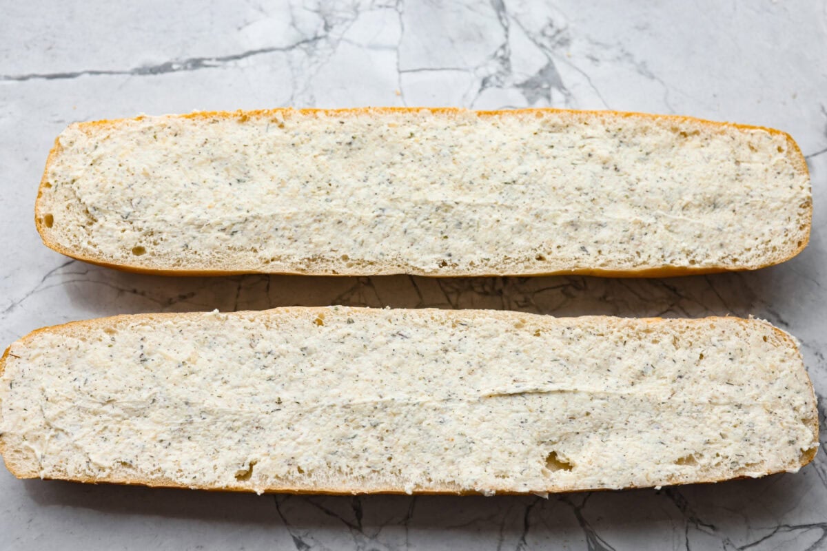 You all loved my best homemade garlic bread so much that an air fryer version was a must! It’s got the same buttery, garlicky magic, just quicker, crispier, and even easier. Garlic butter mixture spread over the halved French bread.