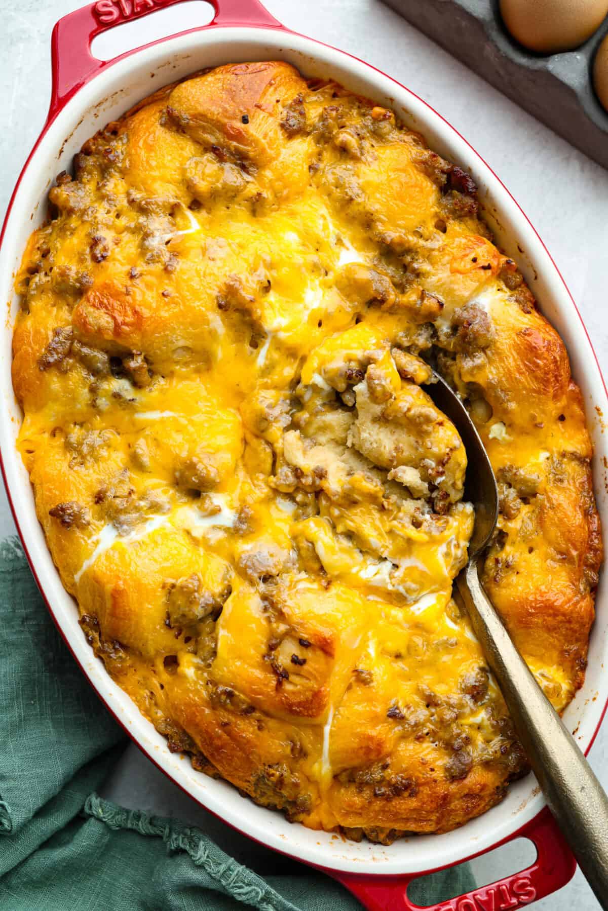Wake up to a breakfast that feels like a warm hug! This Christmas morning casserole turns sausage, eggs, cheese, and fluffy biscuits into the easiest, hearty breakfast you can't get enough of! Christmas morning casserole all baked and ready to serve.