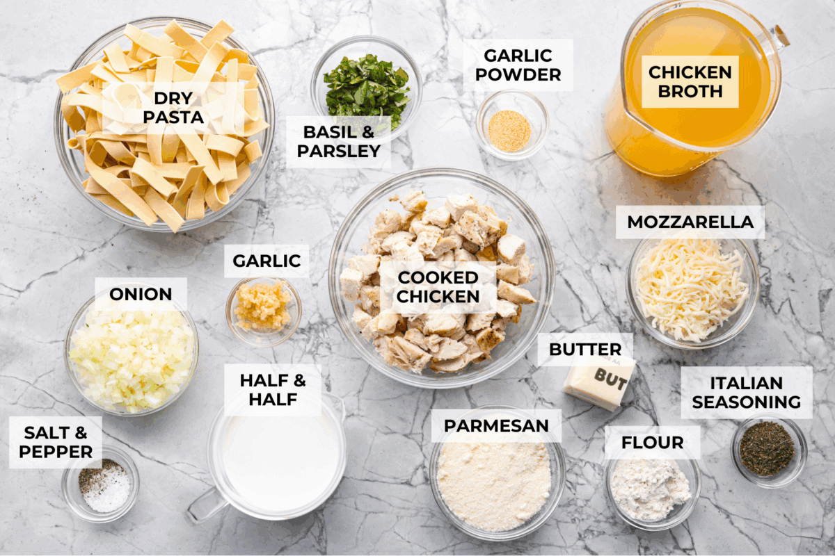 Warm up fast with this creamy, cheesy chicken Alfredo soup! Tender chicken, rich broth, and pasta all come together in just 30 minutes for the ultimate comfort bowl. Overhead shot of labeled ingredients.