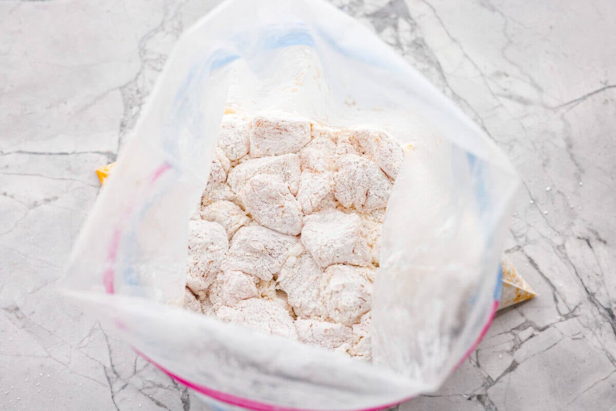 Crispy, saucy, and packed with flavor, this sweet chili chicken is a weeknight winner! Tender chicken bites get a crunchy coating, then get tossed in a sticky, sweet, and slightly spicy sauce that’s impossible to resist. Bag of seasoned chicken covered in corn starch.