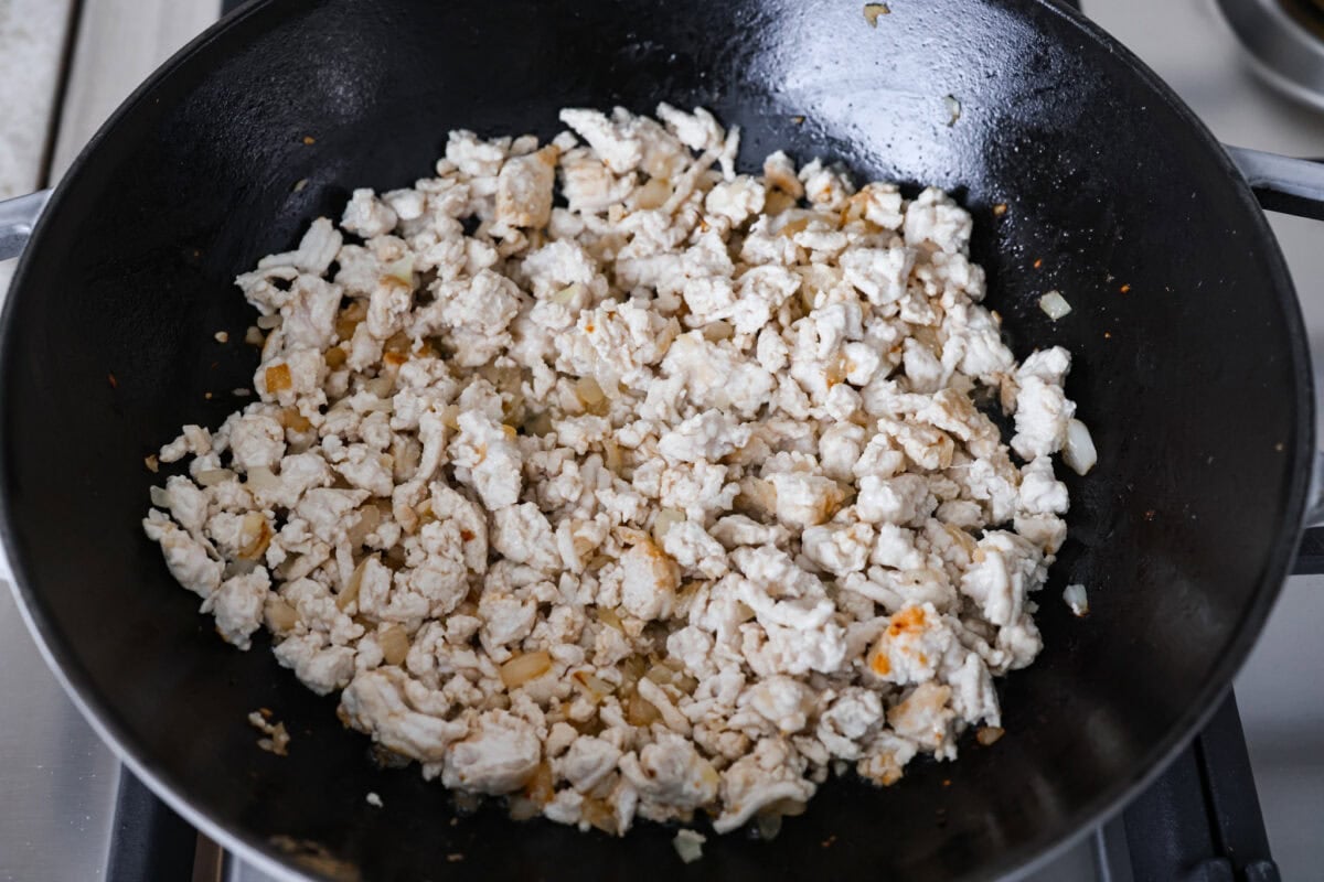 If you haven’t tried egg roll in a bowl yet, you’re in for a treat. Everything you love inside of an egg roll in a lighter, healthier, no-wrapper version! It's ready in 15 minutes, making it a perfect weeknight meal! Ground turkey added to the skillet to brown.