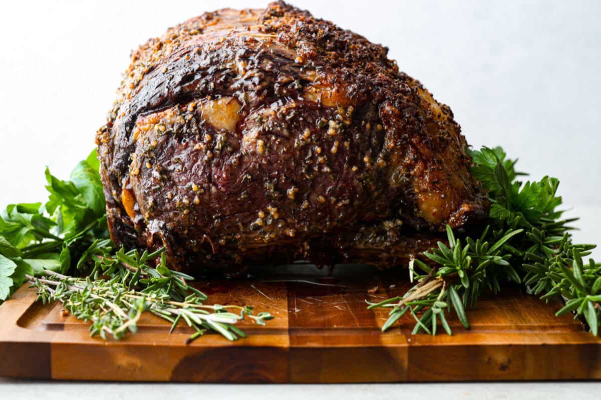 I have the perfect fool proof prime rib recipe for you. I have done all of the testing for you so that you can achieve the perfect prime rib every single time. Melt in your mouth, cooked perfectly to medium rare with a perfect garlic butter crust, this recipe is incredible. I will help you feel confident every step of the way! Fully cooked garlic butter herb crusted roast.
