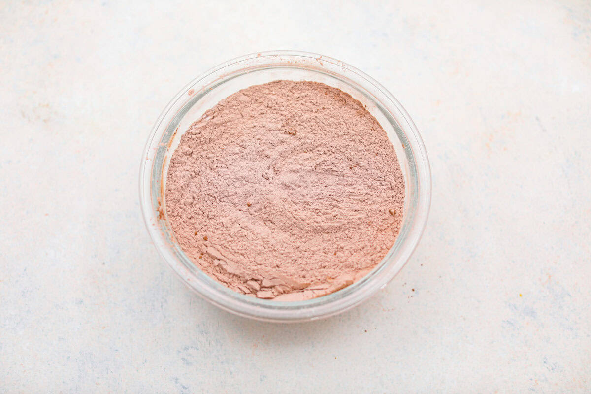 These red velvet crinkle cookies bring all the charm of classic red velvet cake in a festive, crackly cookie. With a soft center, crisp edges, and a snowy sugar coating, they’re as delicious as they are eye-catching. Dry ingredients mixed together in a mixing bowl.