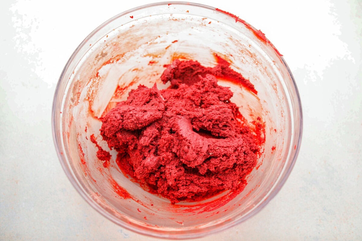 These red velvet crinkle cookies bring all the charm of classic red velvet cake in a festive, crackly cookie. With a soft center, crisp edges, and a snowy sugar coating, they’re as delicious as they are eye-catching. Cookie dough all combined in a bowl.