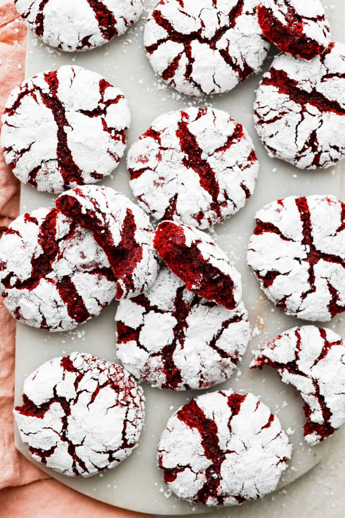 These red velvet crinkle cookies bring all the charm of classic red velvet cake in a festive, crackly cookie. With a soft center, crisp edges, and a snowy sugar coating, they’re as delicious as they are eye-catching. Overhead shot of red velvet crinkle cookies.