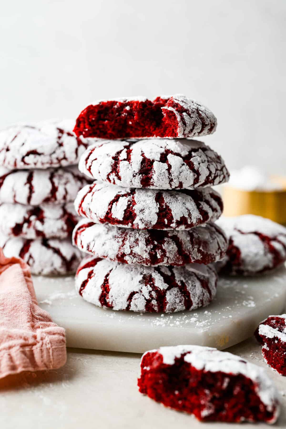 These red velvet crinkle cookies bring all the charm of classic red velvet cake in a festive, crackly cookie. With a soft center, crisp edges, and a snowy sugar coating, they’re as delicious as they are eye-catching. Stack of red velvet crinkle cookies.