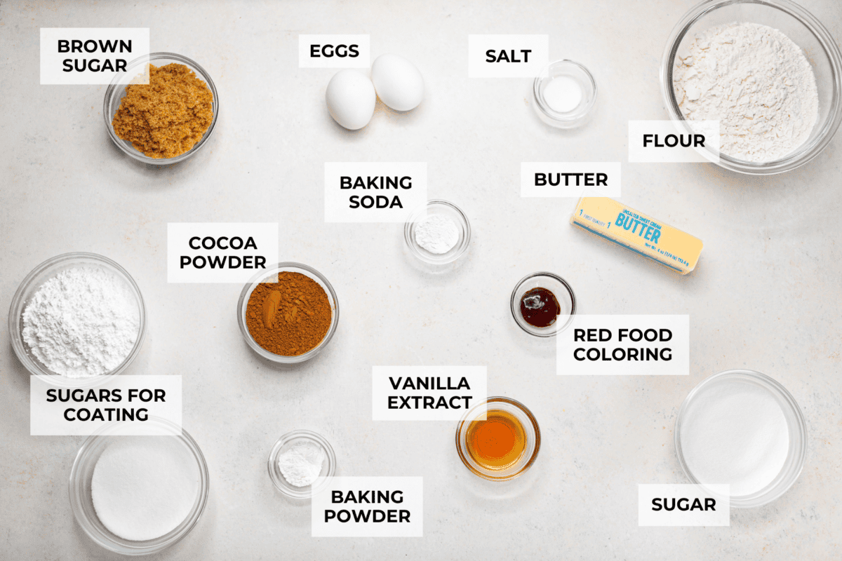 These red velvet crinkle cookies bring all the charm of classic red velvet cake in a festive, crackly cookie. With a soft center, crisp edges, and a snowy sugar coating, they’re as delicious as they are eye-catching. Overhead shot of labeled red velvet crinkle cookies ingredients.