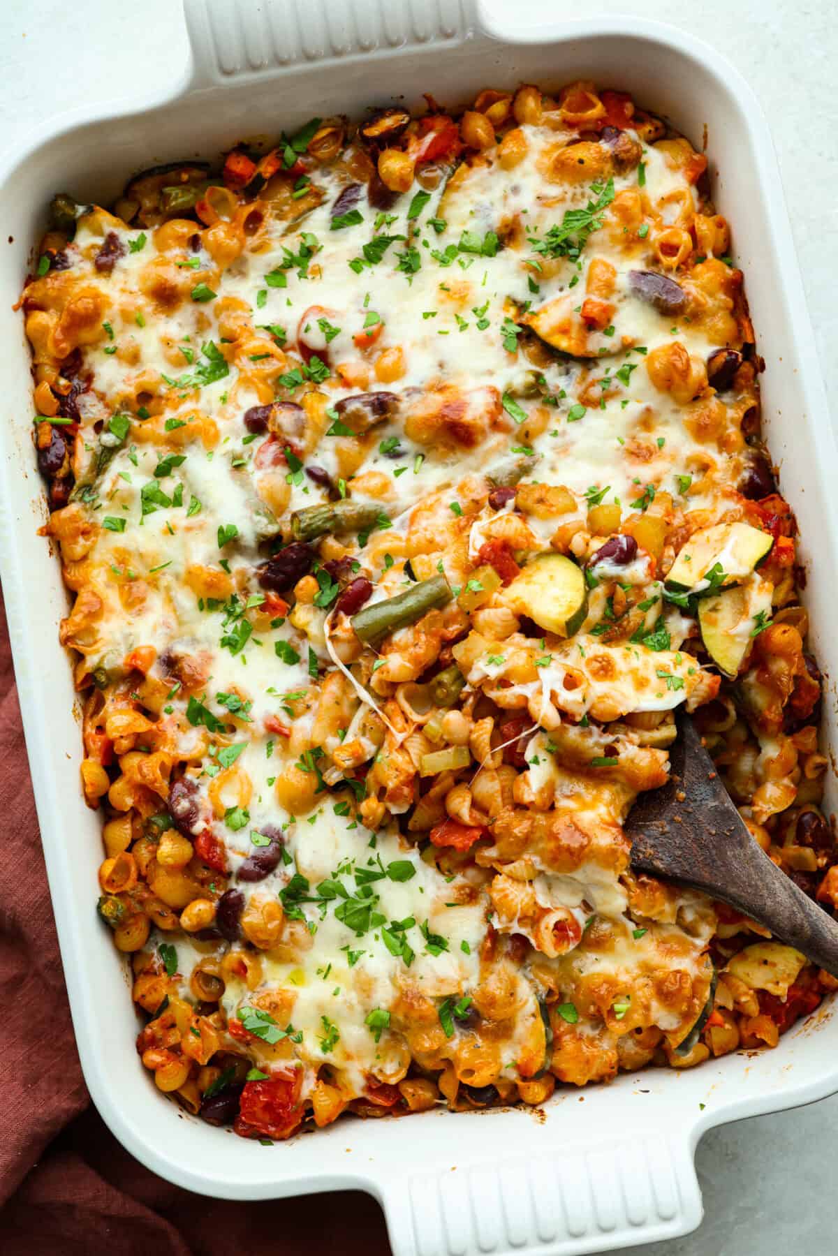 If you love my minestrone soup even a little, you have to try this minestrone casserole. It takes the cozy, veggie packed soup you already love and turns it into a hearty, cheesy pasta bake. It feels like weeknight dinner perfection. Overhead shot of baked minestrone casserole.
