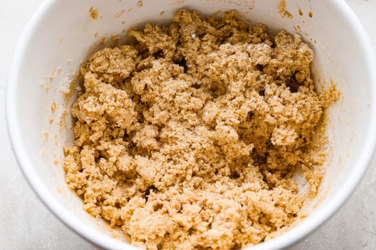 These Neiman Marcus Chocolate Chip Cookies come with a famous backstory, but the real star is the cookie itself. Thick, chewy, and packed with oats, two kinds of chocolate, and crunchy walnuts, they’re truly worth the hype. Wet and dry ingredients combined and mixed together in a bowl.