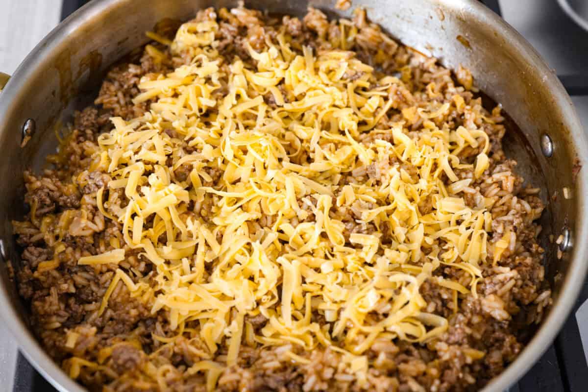 Cheese added to the cheeseburger rice. 
