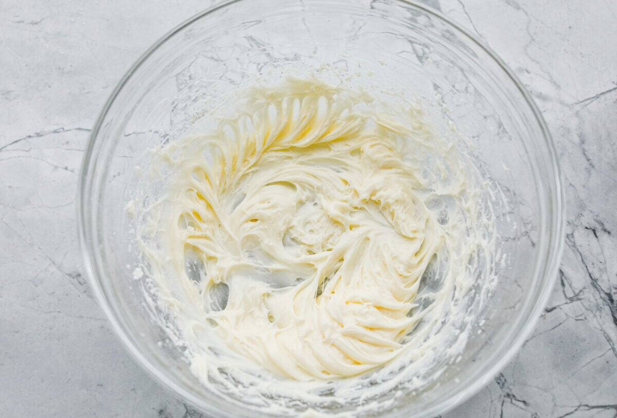 These cinnamon roll butter swim biscuits are my cheat code to making "cinnamon rolls." They bake up soft and fluffy with a sweet cinnamon swirl and icing on top. They disappear almost as fast as you can make them! Butter and powdered sugar added to the cream cheese to make the icing.