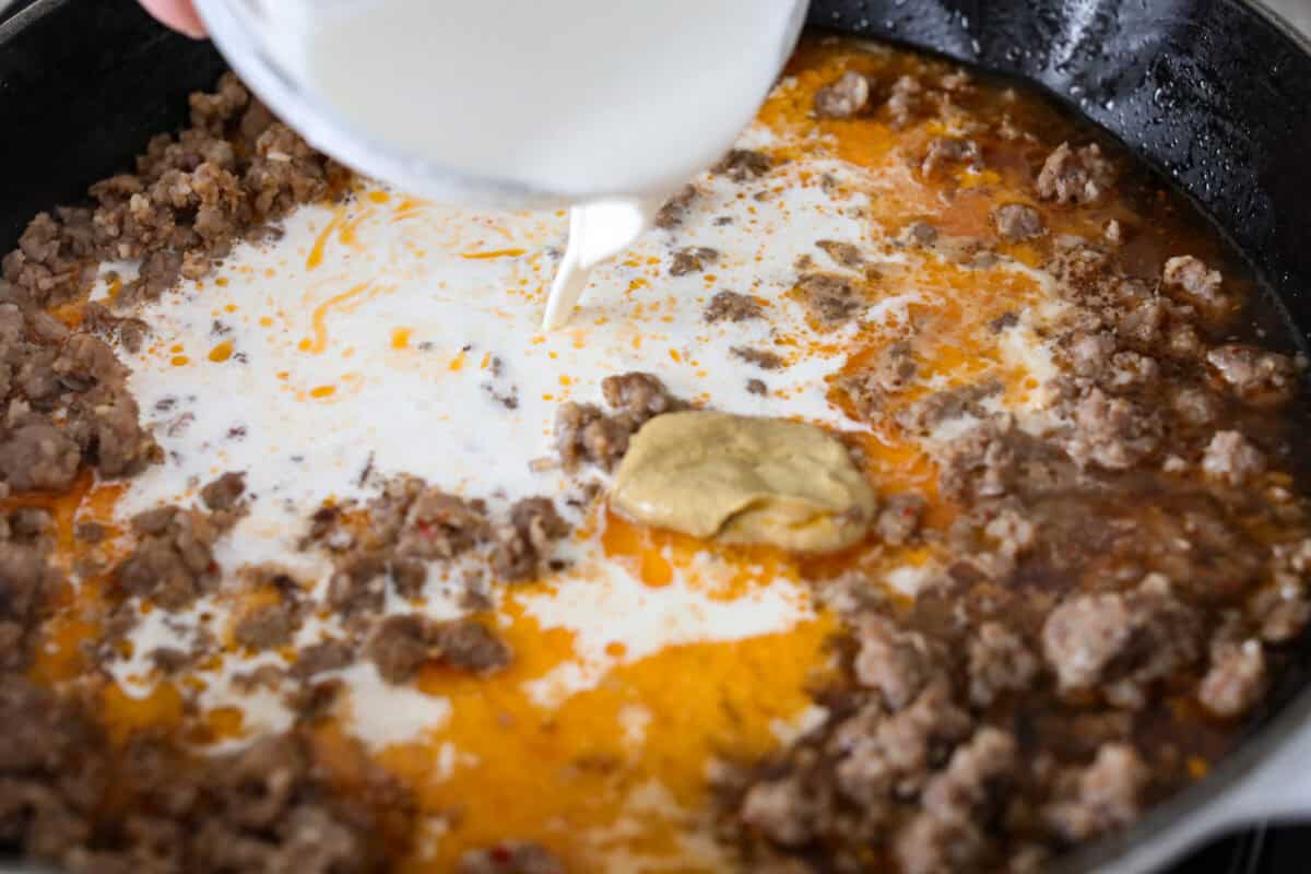 Cream and dijon mustard added to the sausage mixture. 