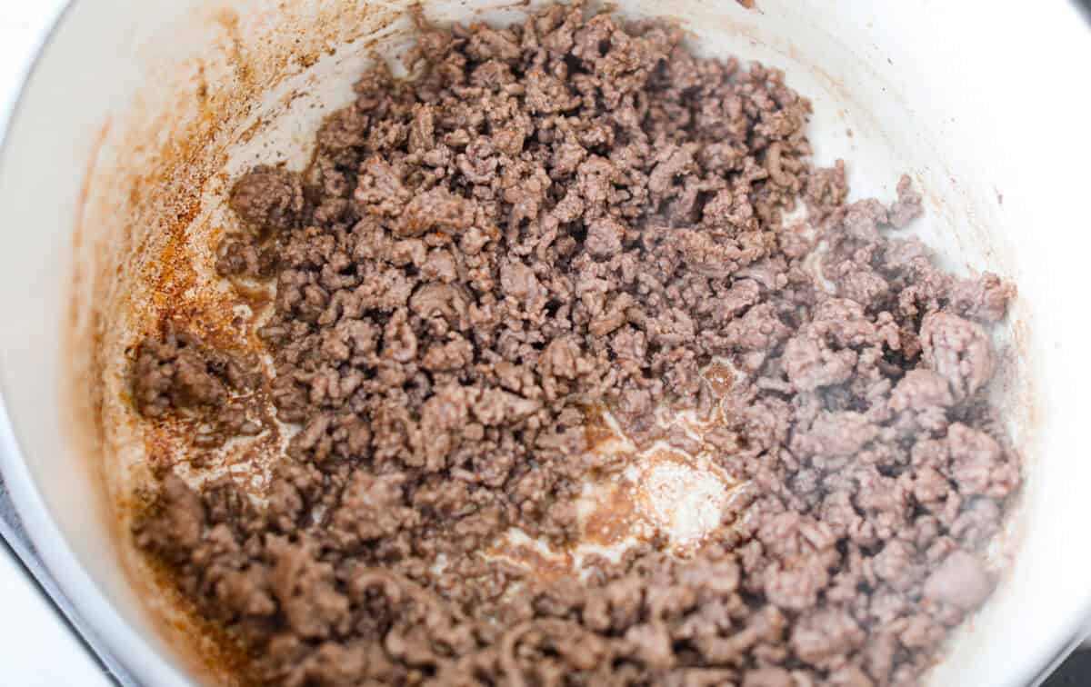 Ground beef cooking in a a large pot. 