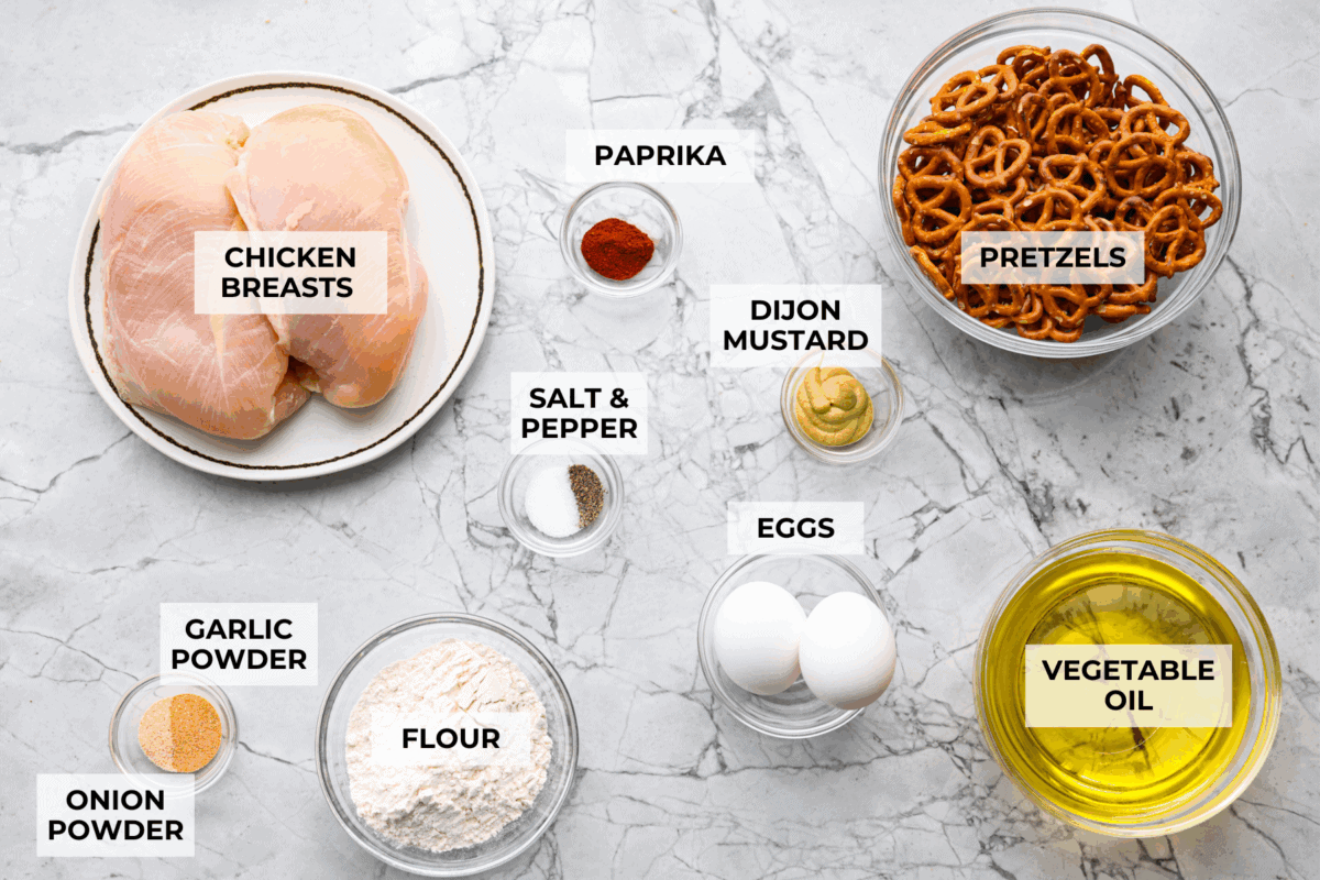 This pretzel crusted chicken takes crispy chicken to the next level. The crunchy pretzel coating adds incredible flavor and texture, making every bite extra delicious. Overhead shot of labeled ingredients.