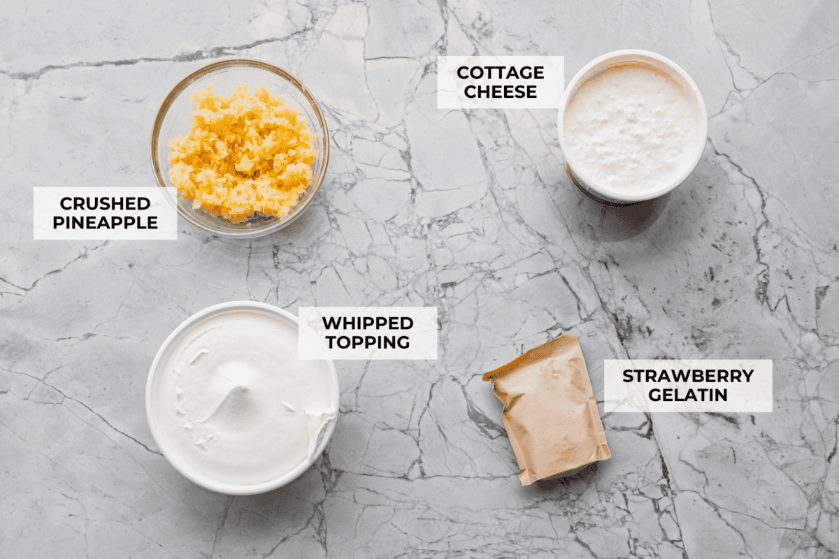 This cottage cheese jello salad is one of those old-school recipes that never really goes out of style. My dad absolutely loves it and requests it all the time, especially for family get-togethers. It’s creamy, fruity, and ridiculously easy to make. Overhead shot of labeled ingredients.