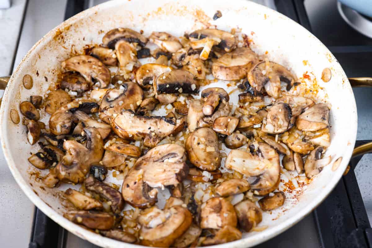Shallots, mushrooms, and garlic added to a skillet!