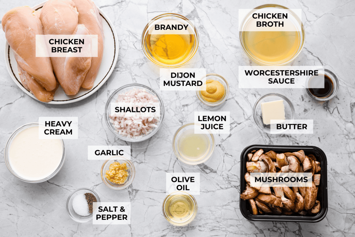 This chicken Diane takes everything you love about steak Diane and turns it into an easy chicken dinner. One skillet, a rich creamy mushroom sauce, and tons of flavor in every bite! Overhead shot of labeled ingredients.