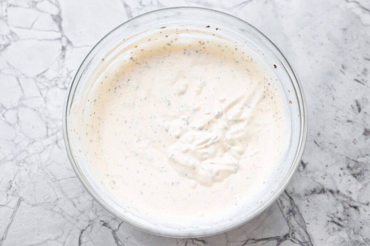 All of the dressing ingredients added to a bowl and mixed together. 