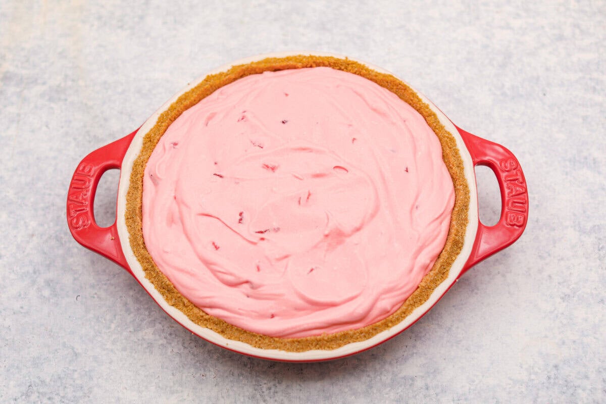 Pie filling ingredients added to the crust ready to be chilled. 