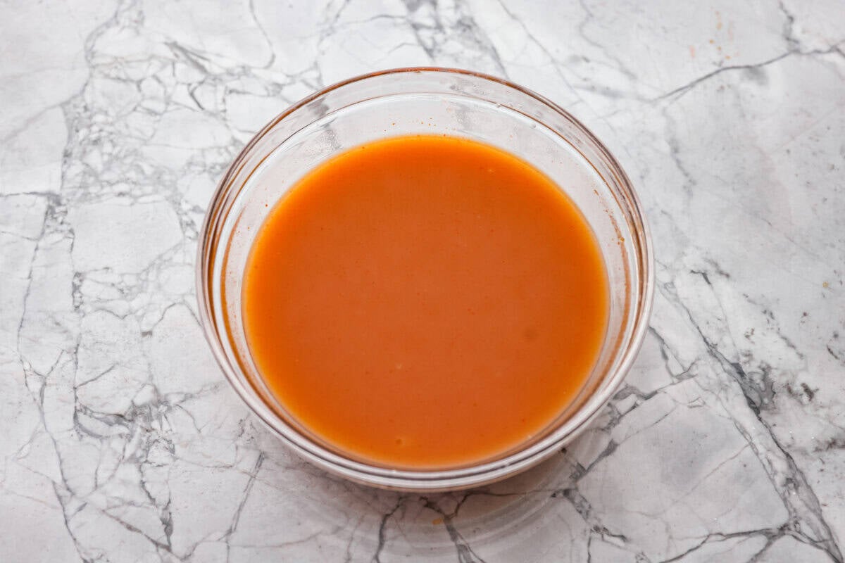 These sweet and sour meatballs are one of those dinners I pull out when I need something easy, but I know everyone likes! They’re saucy, a little sweet, a little tangy, and come together fast. Sauce ingredients all mixed in a bowl.